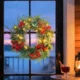 Ghirlanda de Craciun de 60 cm cu lumini LED albe, timer, conuri, boabe si frunze de ilex, verde - imagine 10